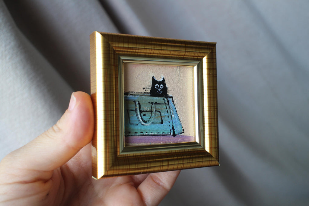 Miniature Black Cat sitting a woman's blue bag Oil Painting (2x2 in)