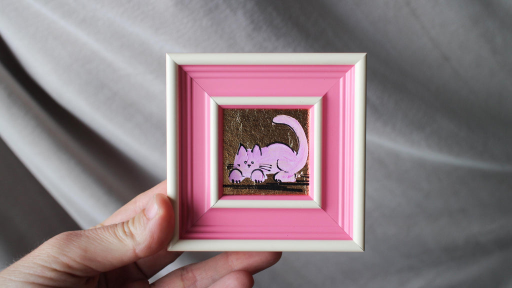 Hand-painted miniature pink cat oil painting with gold leaf background in a pink frame